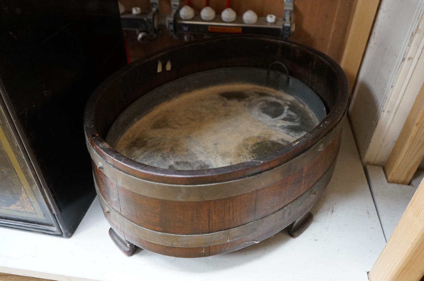 A staved oak jardiniere and a toleware safe with key, largest 52cm high